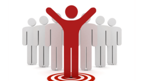 Red person figure in front of other people.