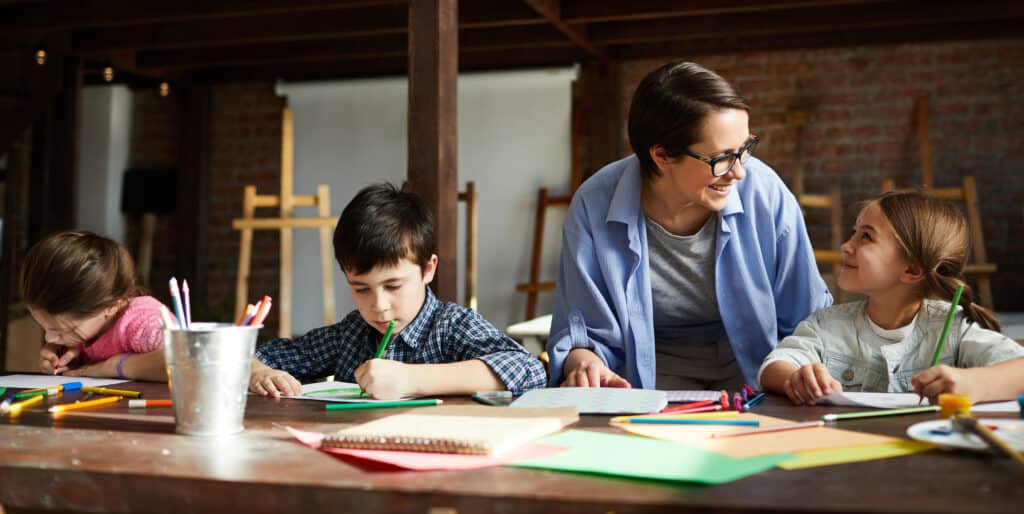 Art Teacher with Group of Kids